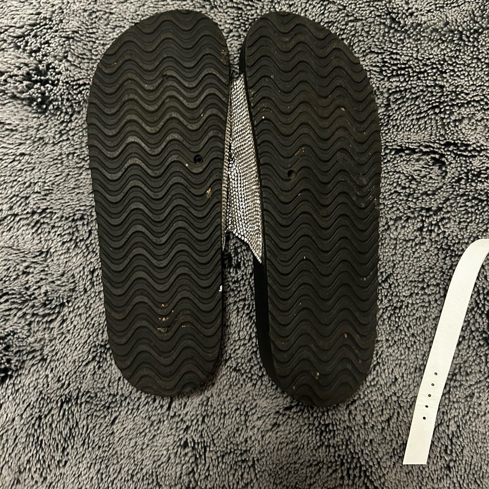 Gently worn Madden Girl black rhinestoned slides